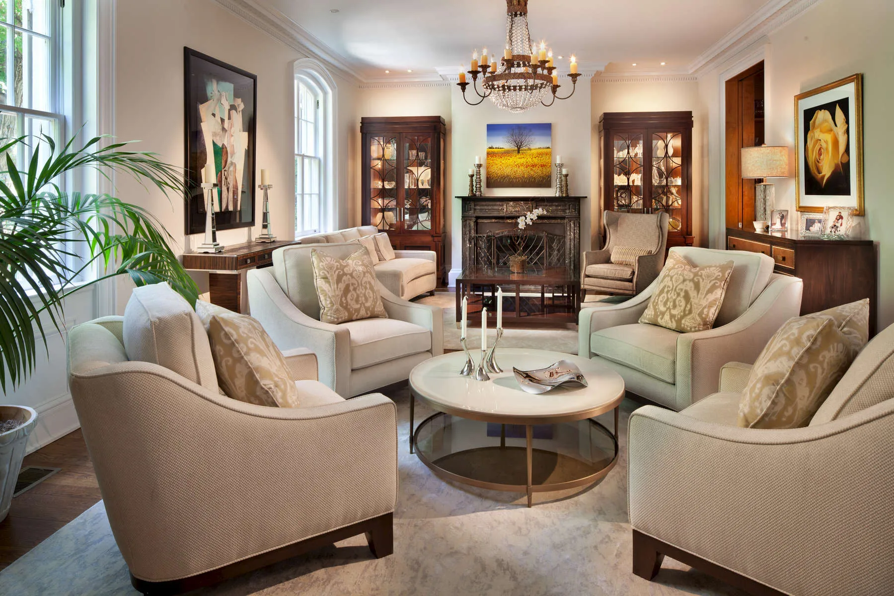 Living room with cream upholstered furniture, framed art and traditional decor