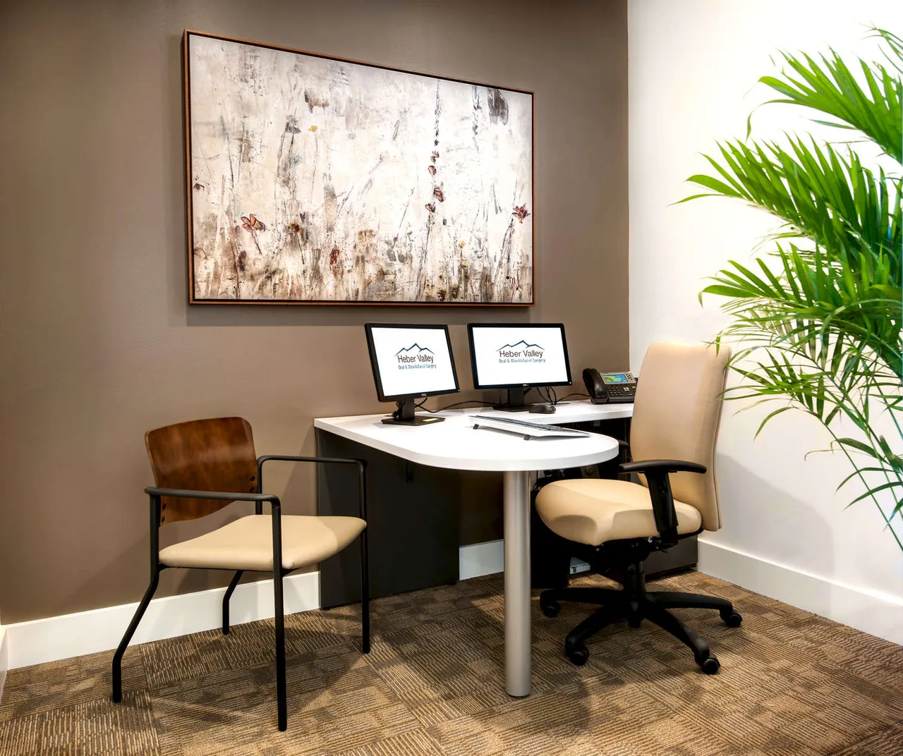 Medical office with a purple accent wall and built-in cabinetry