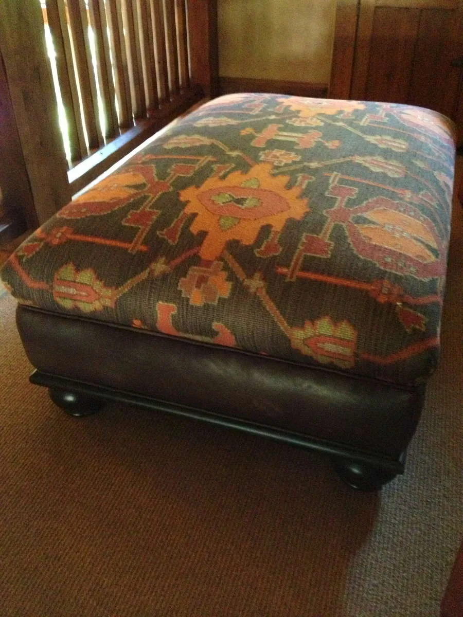 Custom wood coffee table with books stacked on top