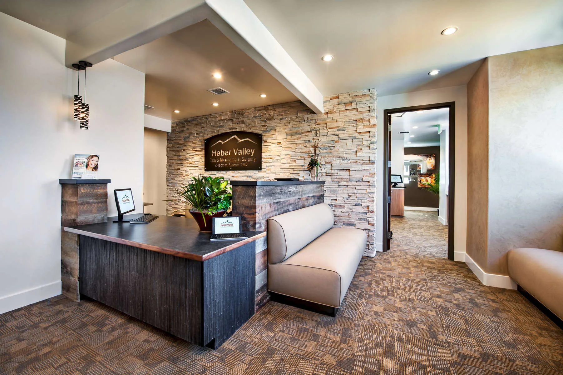 Commercial reception area with abstract art and modern seating