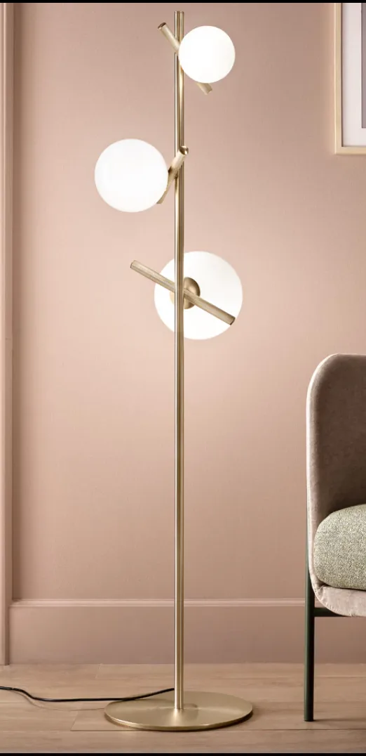 sculptural floor lamp, glass orbs, pink wall - lighting comparison blog