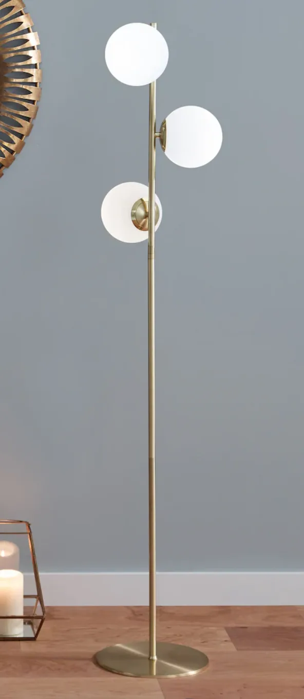 sculptural floor lamp, glass orbs, blue wall - lighting comparison blog