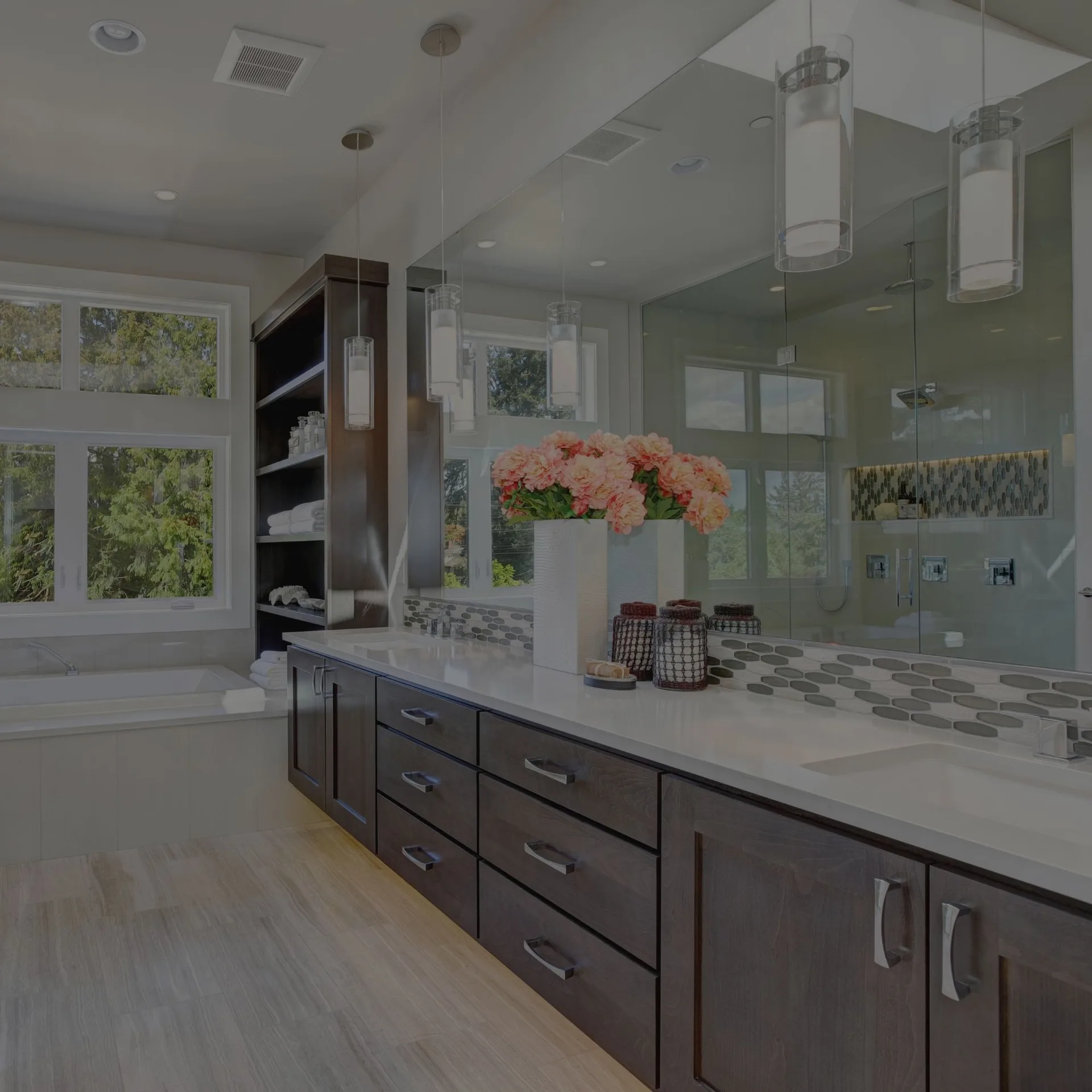 Bathroom with a double vanity and glass shower