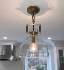 Glass pendant light over the island