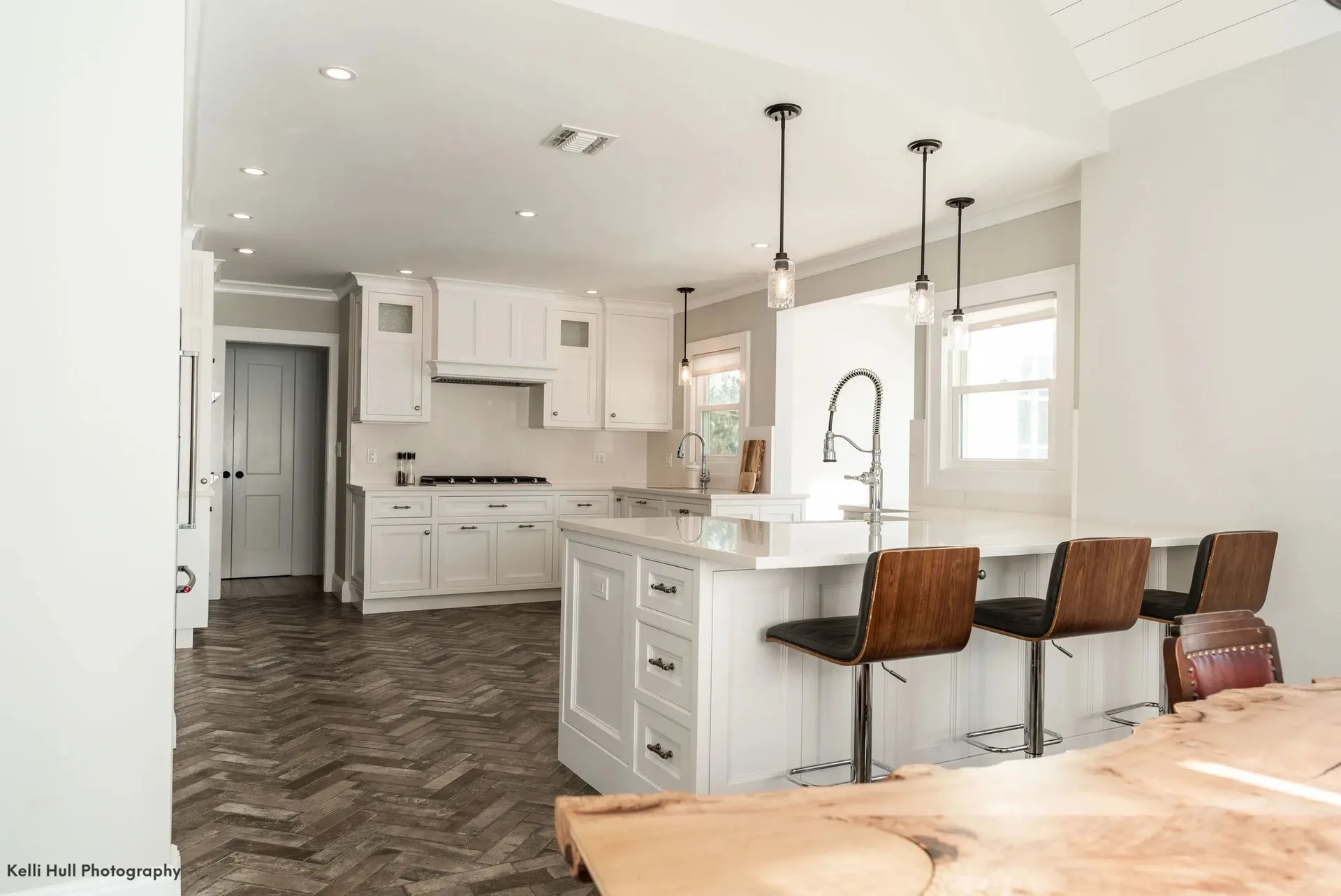 kitchen island with live-edge slab and leather stools, Kitchens & Vanities