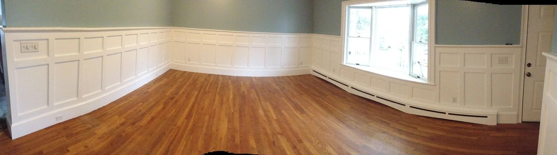 white raised-panel wainscot, wide strip, Paneled Rooms